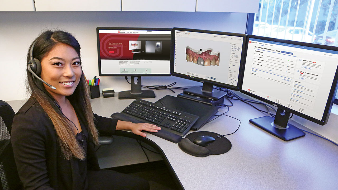 Customer Service Rep with computer screens