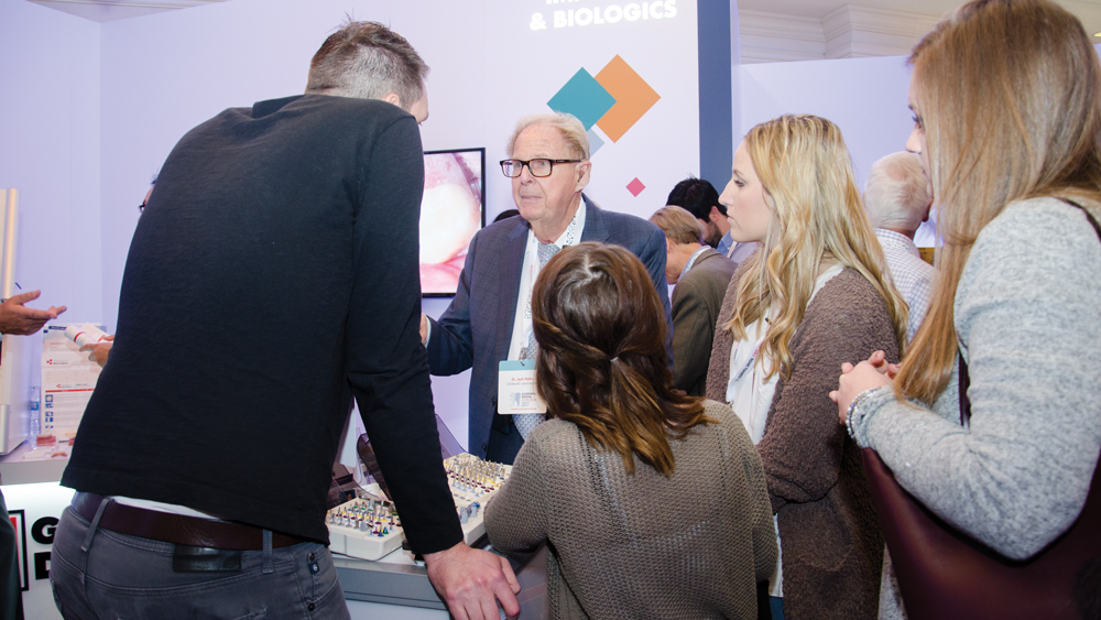 Dr. Jack Hahn discussed the features of the Hahn Tapered Implant System with attendees in the exhibit hall