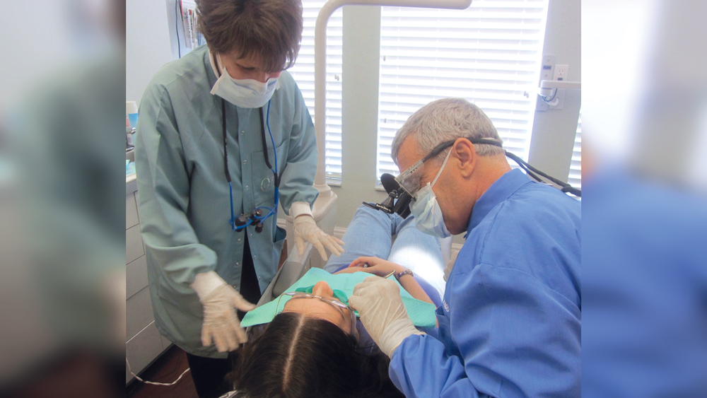 Dr. Dorociak and Dr. Christensen work on a patient together