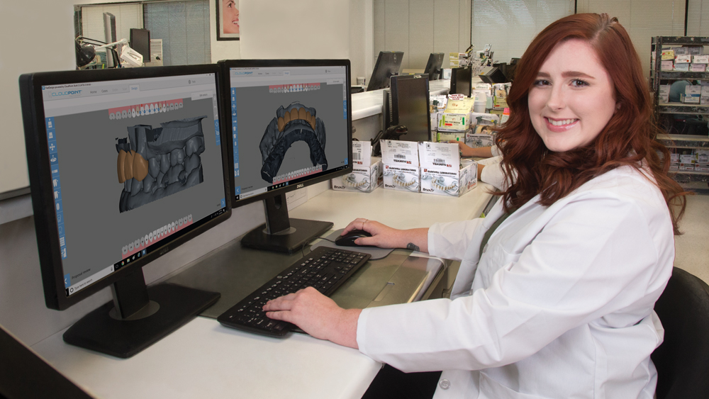 Dental lab worker creating a CAD design