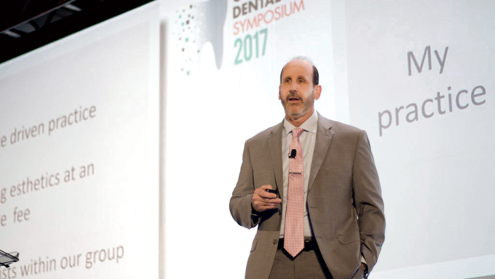 Dr. Steven Barrett speaking at symposium