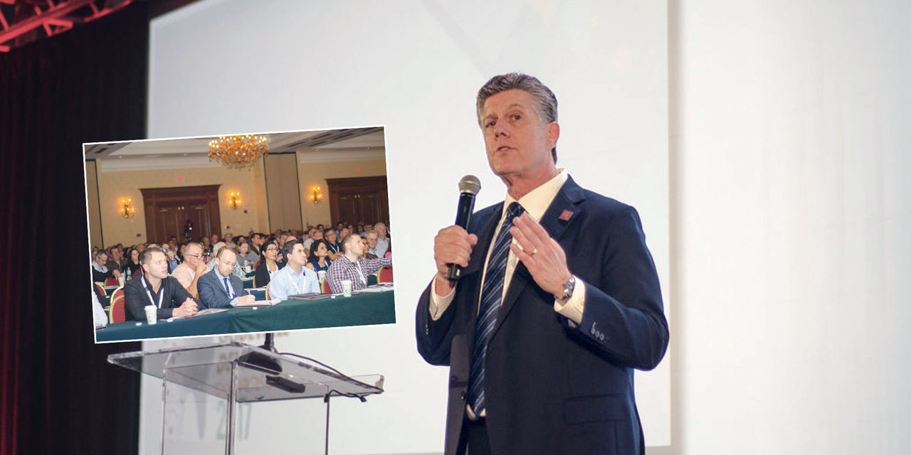 Dr. Neil Park speaking at the symposium