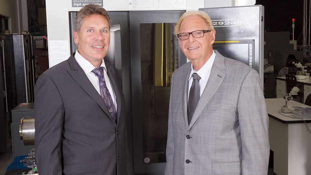 Grant on production floor with Dr. Jack Hahn