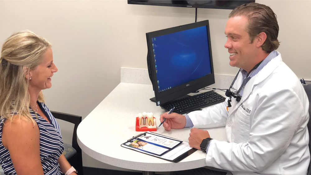 Dr. Gordan and patient discuss implant treatment