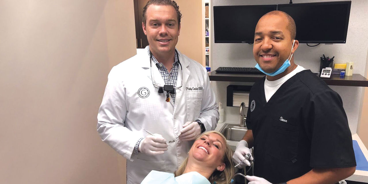 Dr. Philip Gordon with his assistant and patient