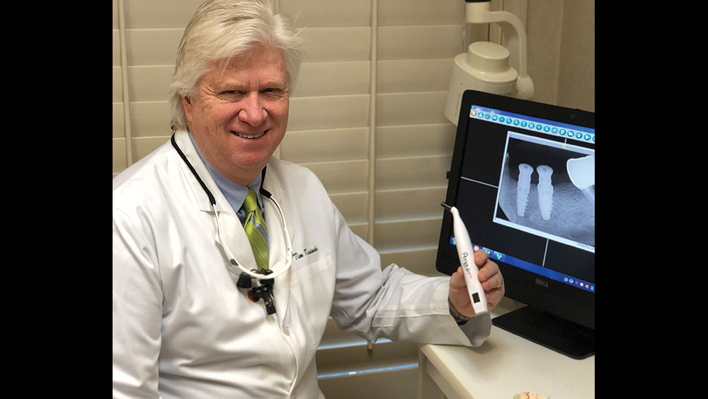 Dr. Kosinski holding the Penguin RFA