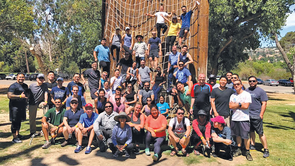 Mike and the Materials R&D department during a team-building exercise