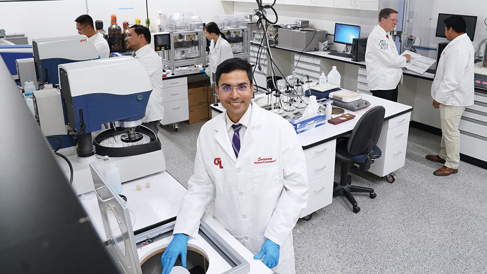 Technicians in lab handling BruxZir Zirconia manufacturing process