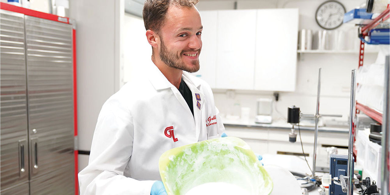 Glidewell lab worker with raw material