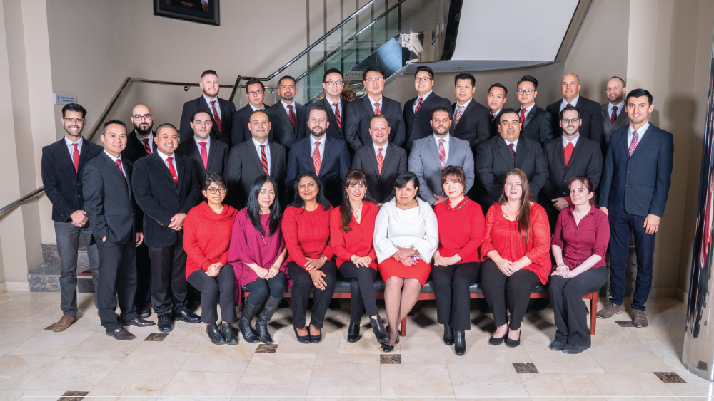 Darius with some of the members of his team sitting