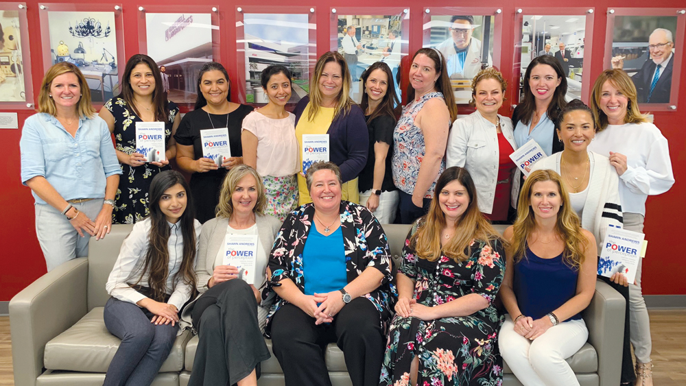 Dr. Shawn Andrews (pictured in blue) with other female dentists