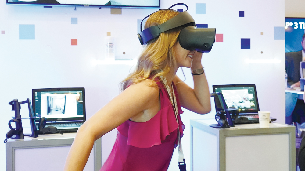 An attendee using a VR headset in a live demonstration