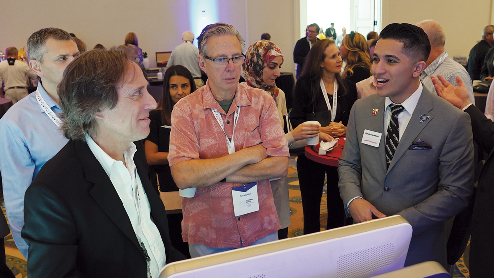 An instructor shows attendees how to use the glidewell.io In-Office Solution