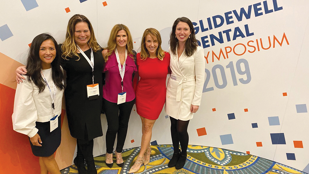 Mentors and collegues pose for a photo during a networking opportunity