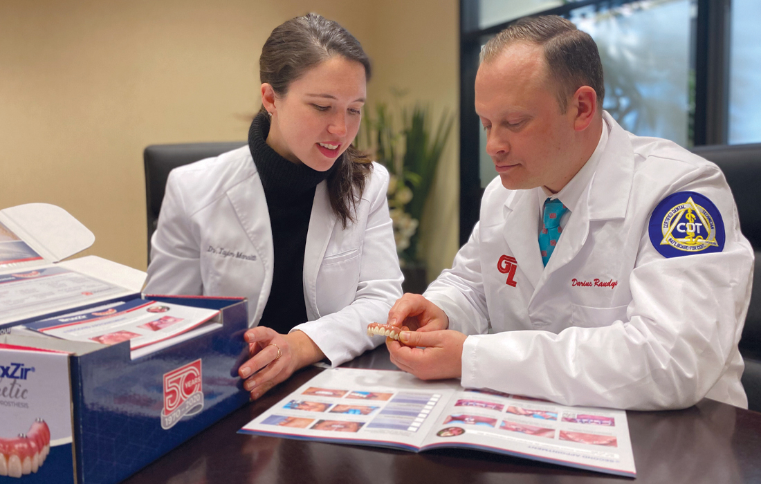 Dr. Taylor Manalili discusses prosthesis design and fabrication with Darius Raudys, CDT, general manager of the Implant department at Glidewell.