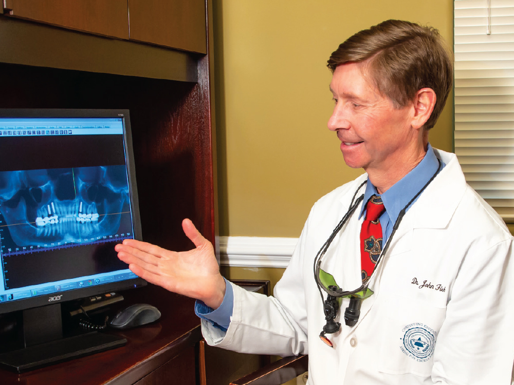 Dr. John Fish with computer