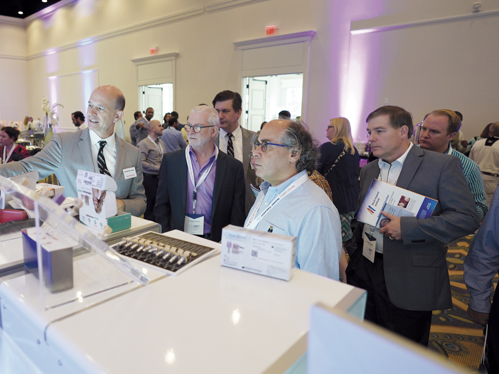 Men networking at Glidewell Convention CSMV16I1