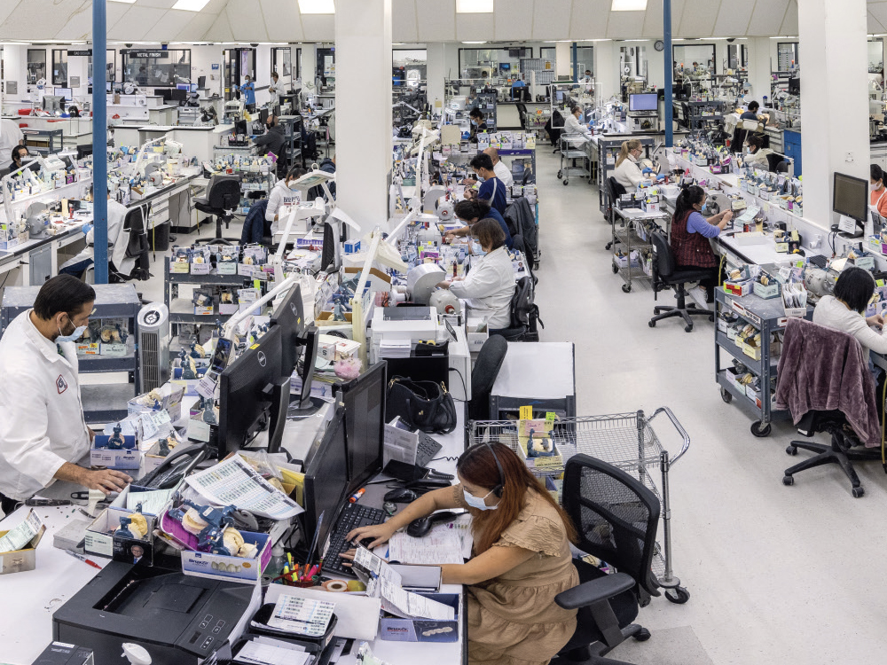 More lab workers working on dental products
