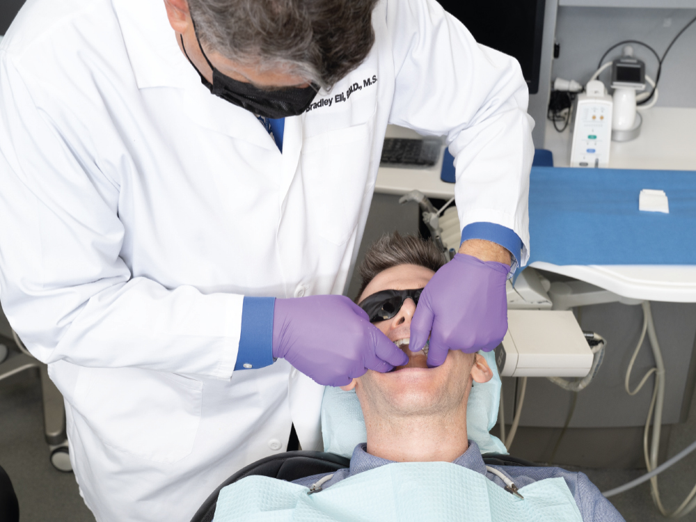 Dentist addressing sleep therapy for patient