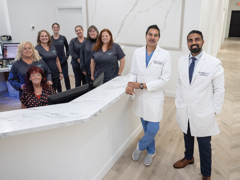 Drs. Sandeep Patel, Darshan Patel and their staff