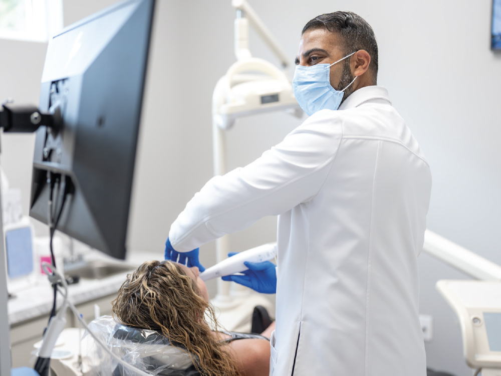 Dr. Darshan Patel scans patient