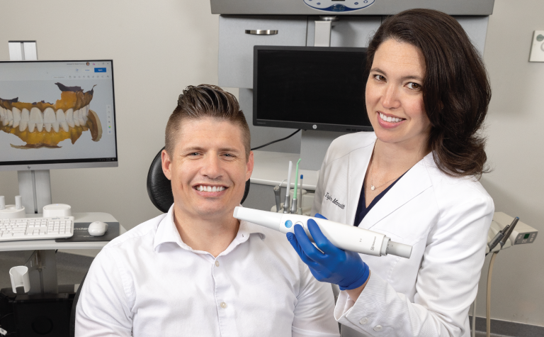 Dr. Manalilli with patient and intraoral scanner